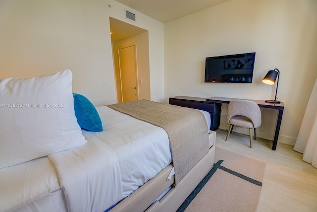 bedroom with light hardwood / wood-style flooring