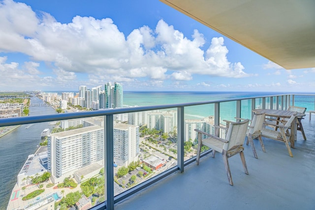 balcony featuring a water view