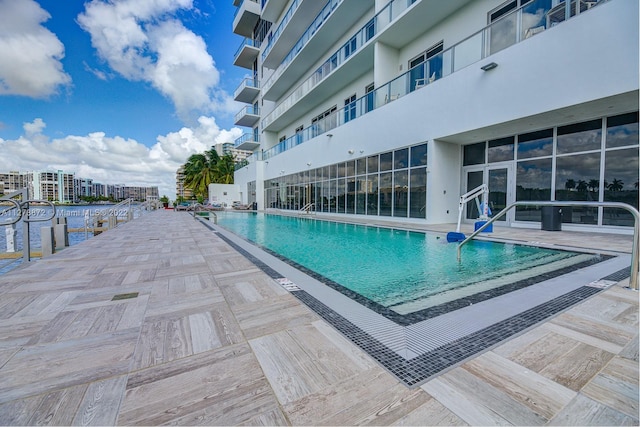 view of swimming pool featuring a patio area