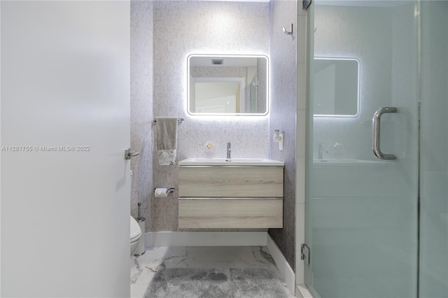 bathroom with tile floors, walk in shower, toilet, and vanity