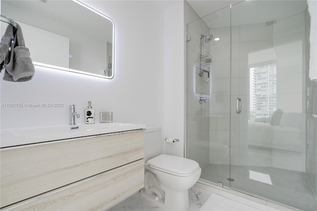 bathroom with toilet, large vanity, an enclosed shower, and tile flooring