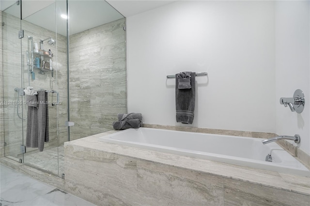 bathroom with tile floors and separate shower and tub