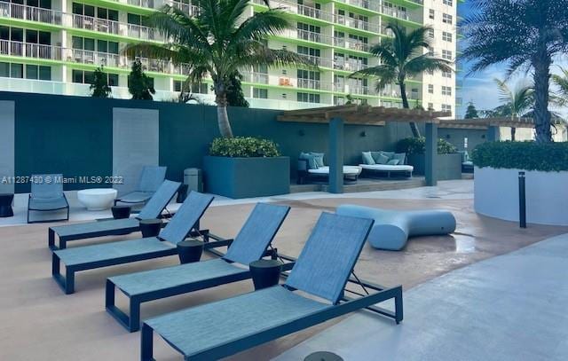 view of patio / terrace with an outdoor hangout area and a balcony