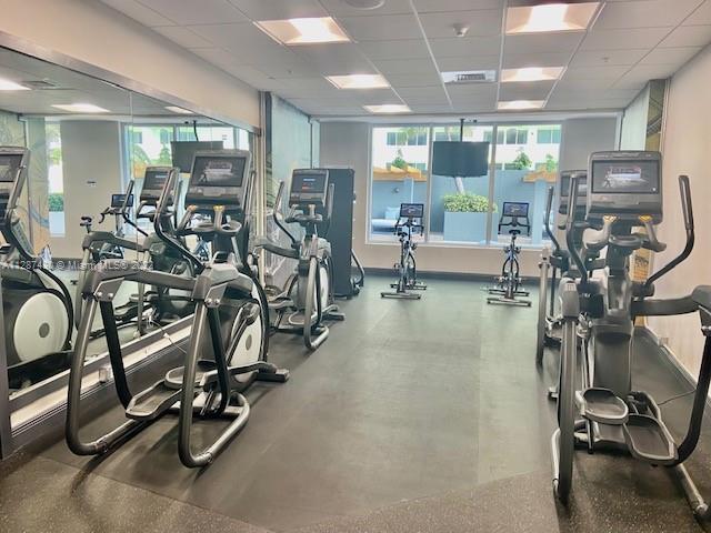 gym featuring a paneled ceiling