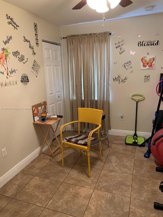 dining area featuring tile flooring and ceiling fan