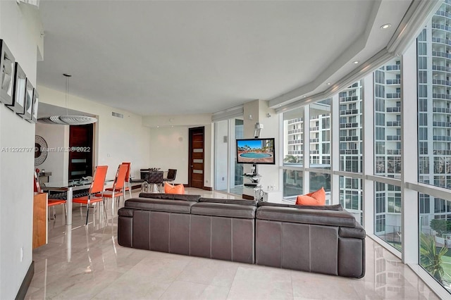 living room featuring light tile floors