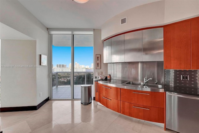 kitchen with sink, light tile floors, expansive windows, backsplash, and stainless steel counters