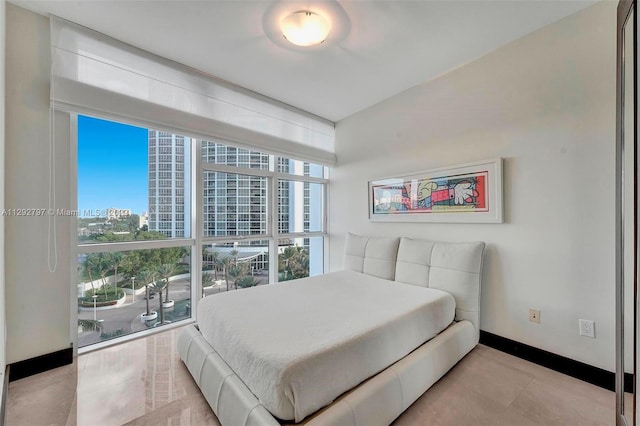 bedroom featuring light tile floors