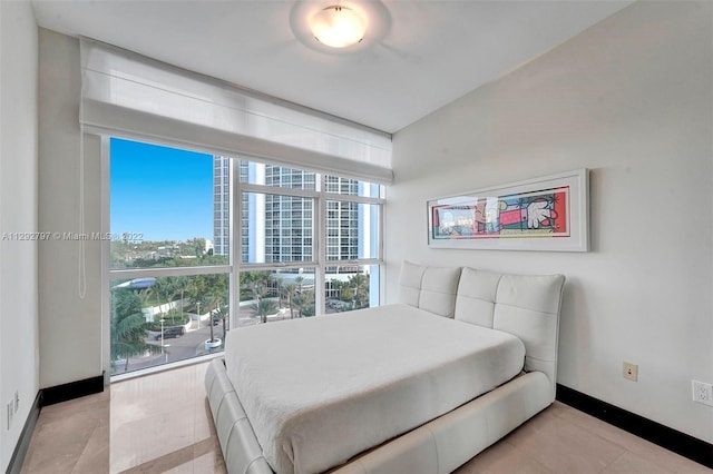 bedroom featuring light tile floors