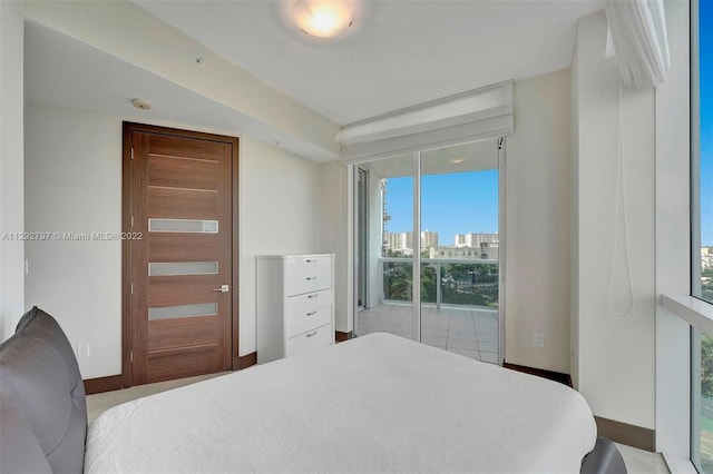 tiled bedroom with access to exterior