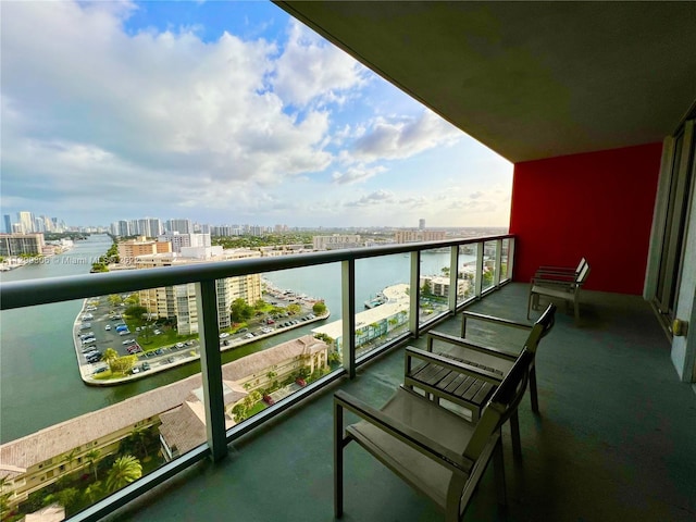 balcony featuring a water view