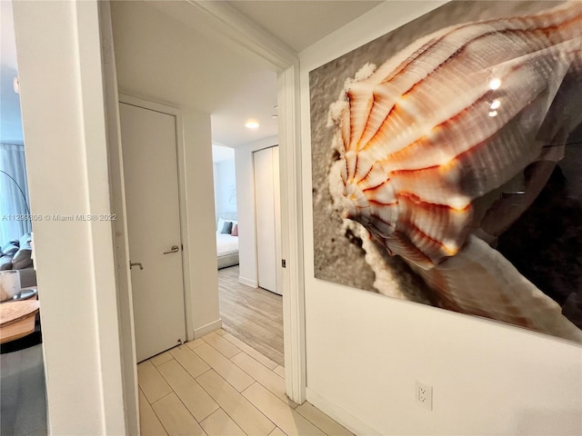 hall with light hardwood / wood-style flooring