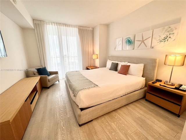 bedroom featuring light wood-type flooring