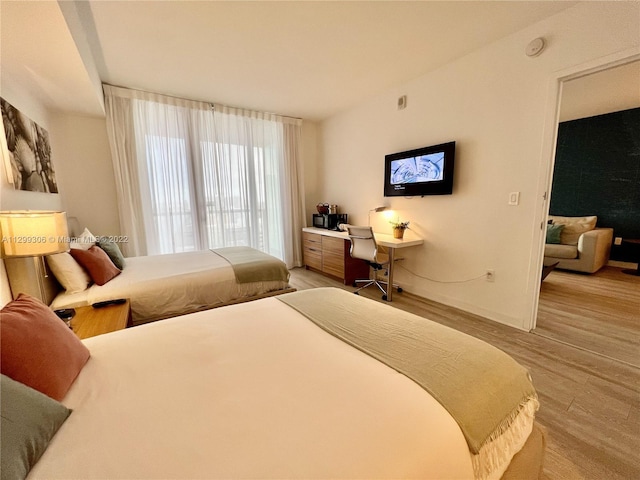 bedroom with light hardwood / wood-style floors