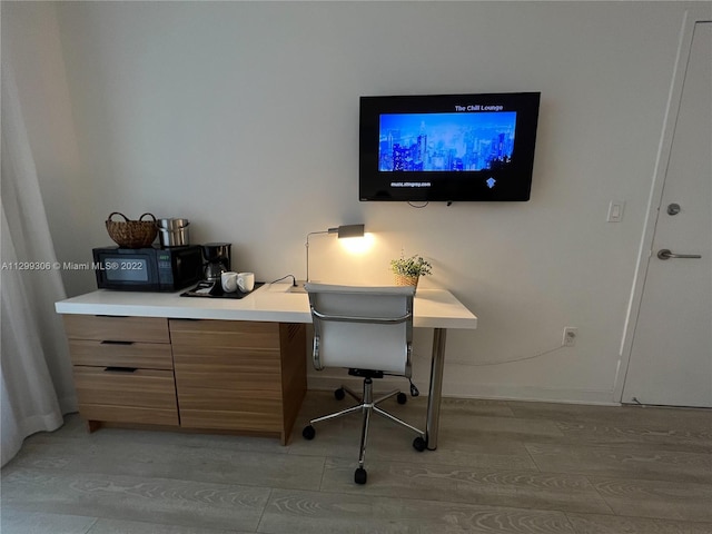 home office featuring light wood-type flooring