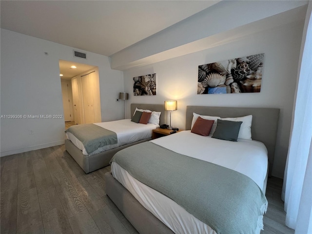 bedroom featuring dark wood-type flooring