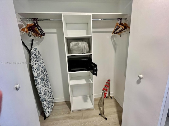 spacious closet featuring light hardwood / wood-style floors