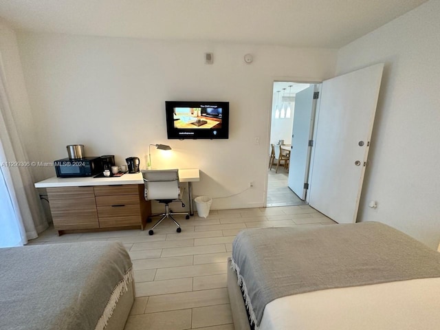 bedroom featuring light tile floors