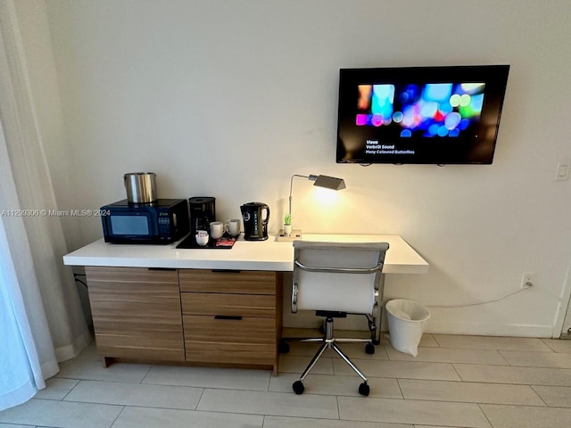 office space featuring light tile flooring