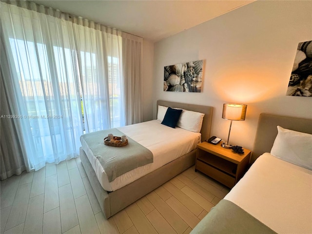 bedroom with light wood-type flooring