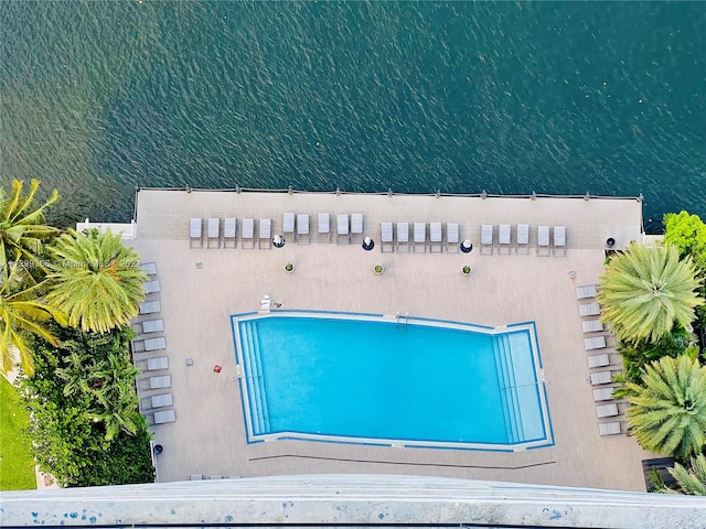 view of pool with a water view