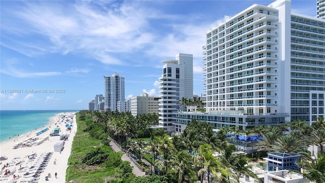 exterior space featuring a beach view and a water view