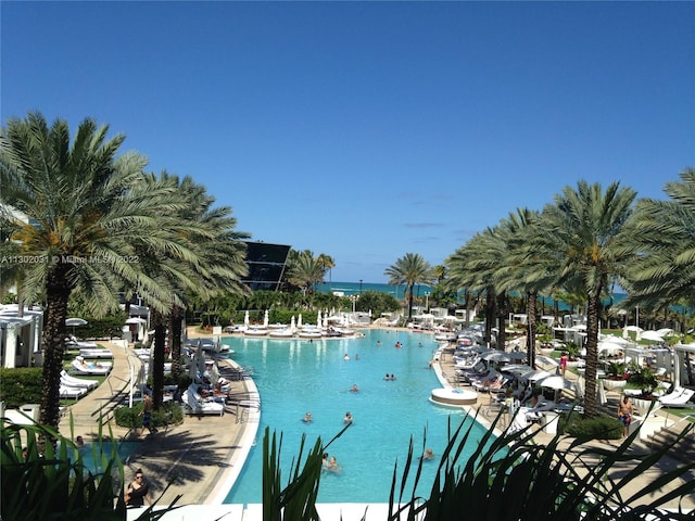 view of pool with a water view