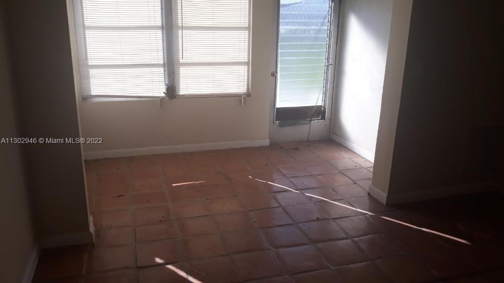 empty room featuring tile patterned floors