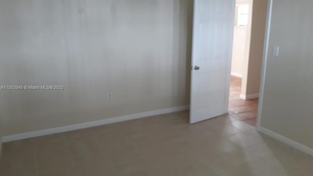 6520 Winfield Blvd Unit 103, Margate, FL 33063 - empty room featuring light tile patterned floors and baseboards