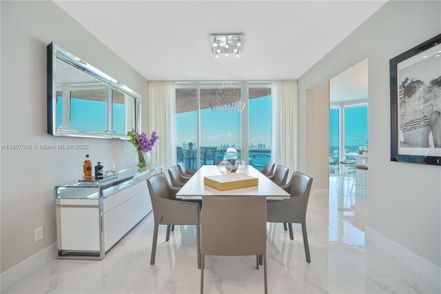 dining space featuring light tile floors