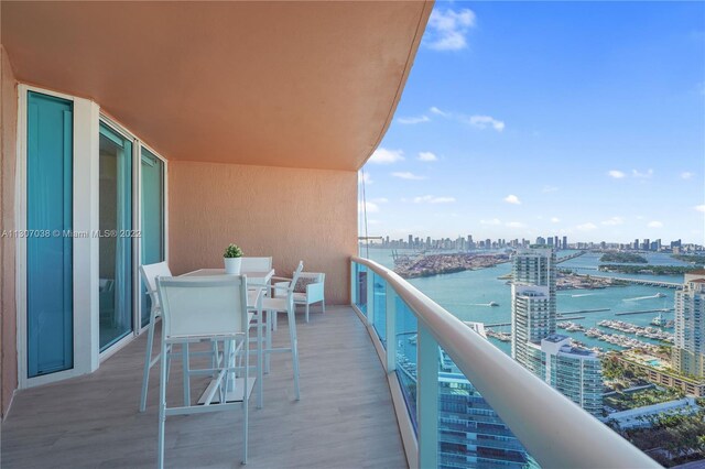 balcony featuring a water view