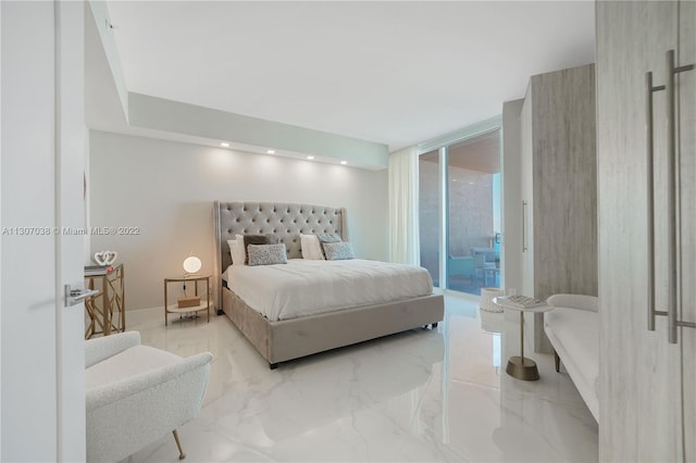 bedroom featuring floor to ceiling windows, access to exterior, and light tile flooring