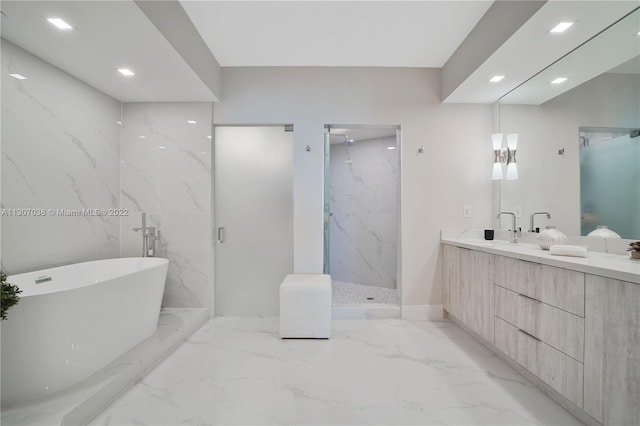 bathroom featuring separate shower and tub, vanity, and tile flooring