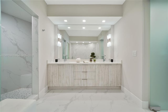 bathroom featuring double vanity, tile floors, and a tile shower