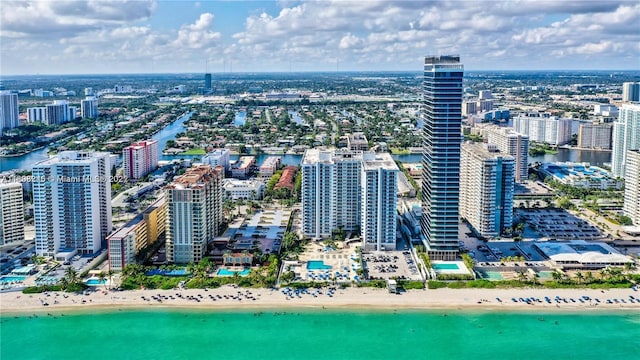 birds eye view of property featuring a water view and a view of the beach