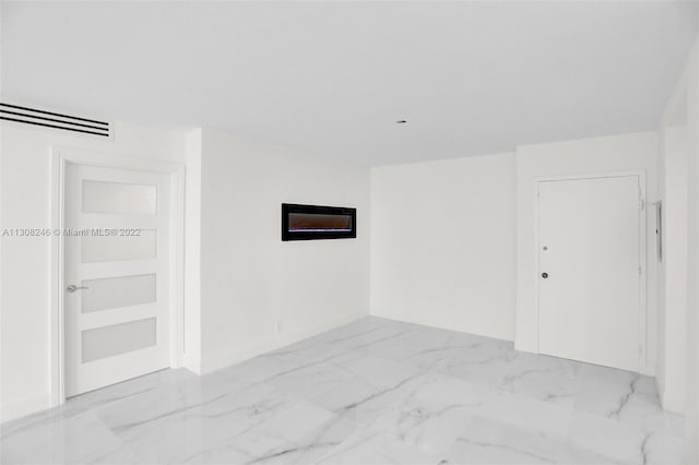 tiled empty room featuring built in features