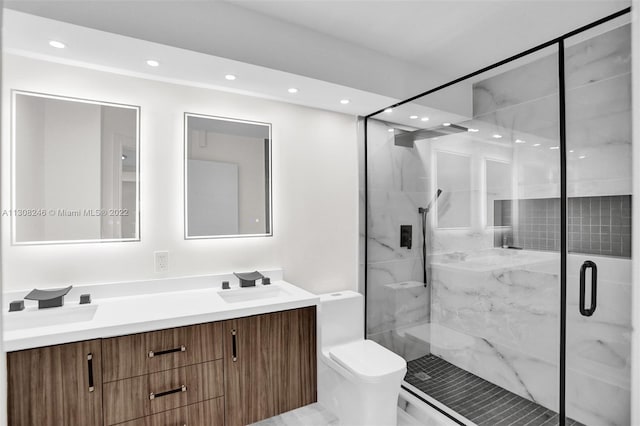 bathroom with walk in shower, oversized vanity, and toilet