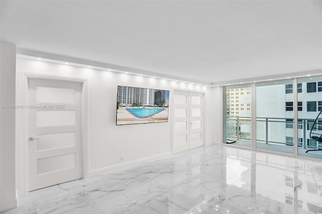 spare room featuring light tile flooring