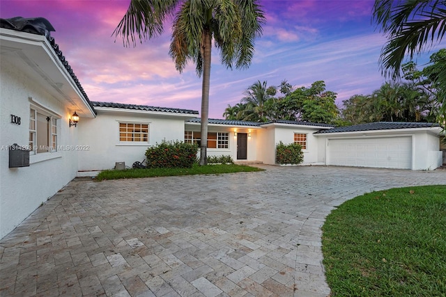 view of front of property with a garage