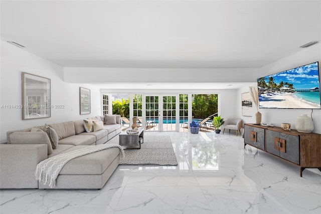 living room featuring light tile floors