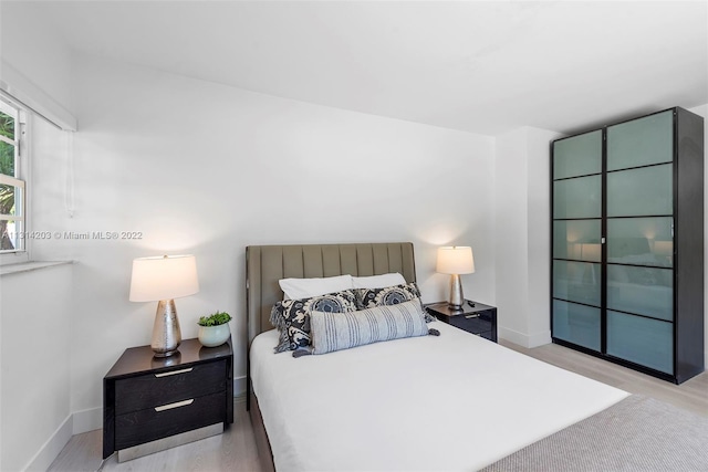 bedroom featuring light wood-type flooring