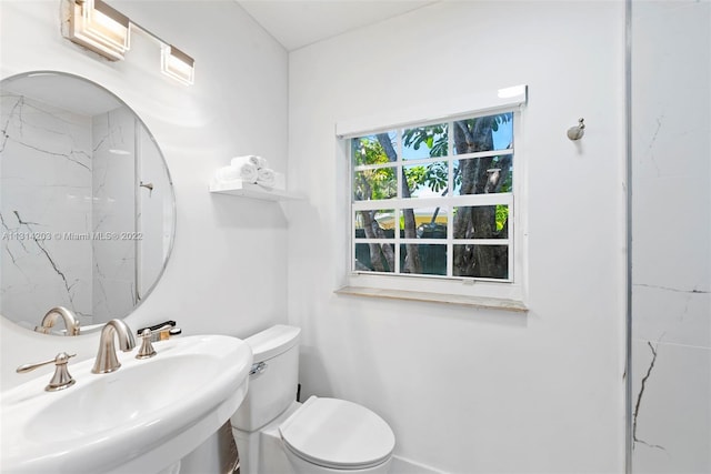 bathroom with toilet and sink