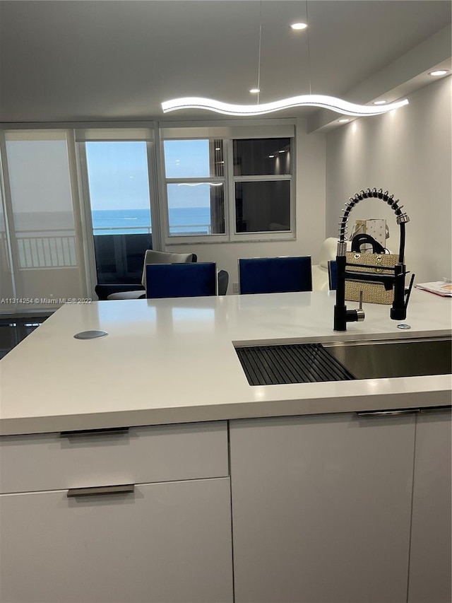 kitchen with white cabinets and sink