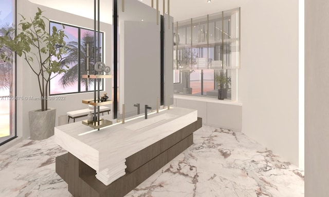 bathroom featuring a wealth of natural light, sink, and tile patterned floors