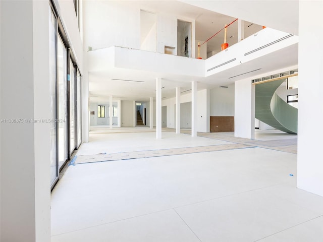 interior space featuring a towering ceiling