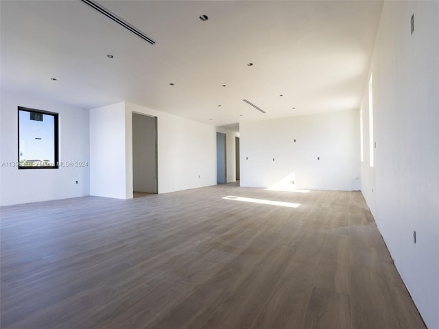 unfurnished room featuring hardwood / wood-style flooring