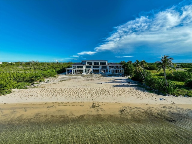 view of home's community featuring a view of the beach