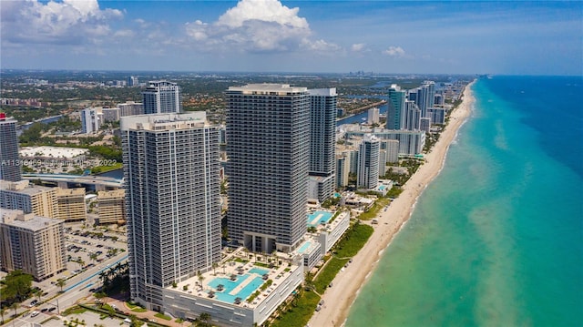 bird's eye view with a water view and a view of the beach