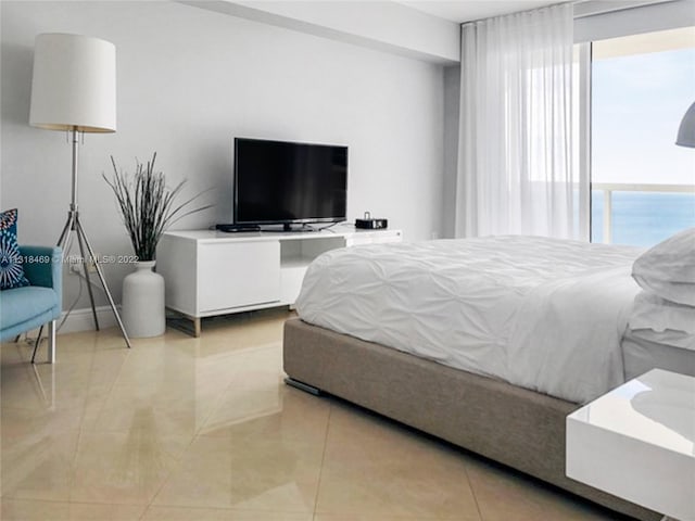 bedroom with light tile floors