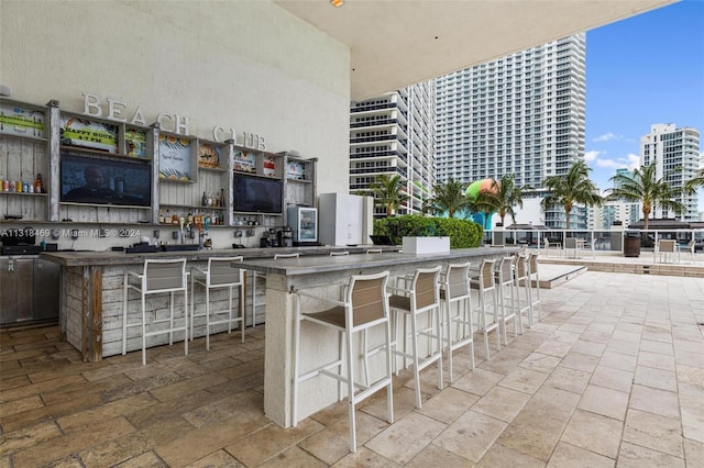 view of terrace with an outdoor bar